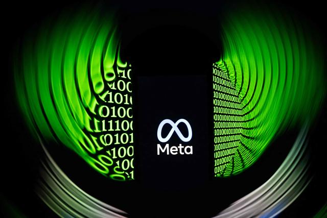 (FILES) This illustration photograph shows the logo of the US multinational technology Meta company displayed on a smartphone in Mulhouse, eastern France on February 11, 2026. The EU ordered Meta on June 9, 2026 to give rival AI chatbots access to its WhatsApp platform for free within five working days as it carries out an antitrust probe, or risk a heavy fine. (Photo by SEBASTIEN BOZON / AFP)