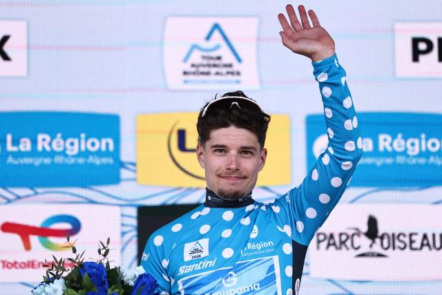 Groupama-FDJ United's French rider Clément Braz Afonso celebrates on the podium wearing the climber's dotted jersey after the 3rd stage of the Tour Auvergne-Rhone-Alpes cycling race (formerly known as the Criterium du Dauphine), 28,4km team time trial departing and arriving in Perreux central France, on June 9, 2026. (Photo by Anne-Christine POUJOULAT / AFP)