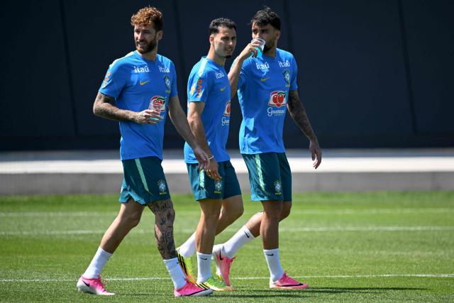 Brazil's defender Leo Pereira (L), forward Gabriel Martinelli (C) and midfielder Lucas Paqueta walk on the pitch during a training session as part of the team's preparation for its FIFA World Cup football tournament opening match against Morocco at Columbia Park Training Facility in Morristown, New Jersey on June 9, 2026. (Photo by MAURO PIMENTEL / AFP)