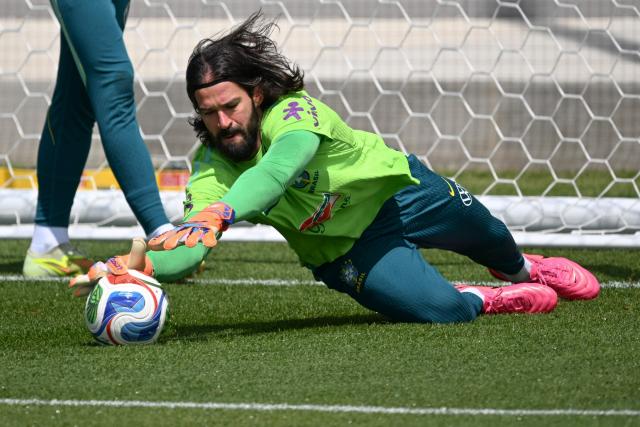 Brazil's goalkeeper Alisson dives for a ball during a training session as part of the team's preparation for its FIFA World Cup football tournament opening match against Morocco at Columbia Park Training Facility in Morristown, New Jersey on June 9, 2026. (Photo by MAURO PIMENTEL / AFP)