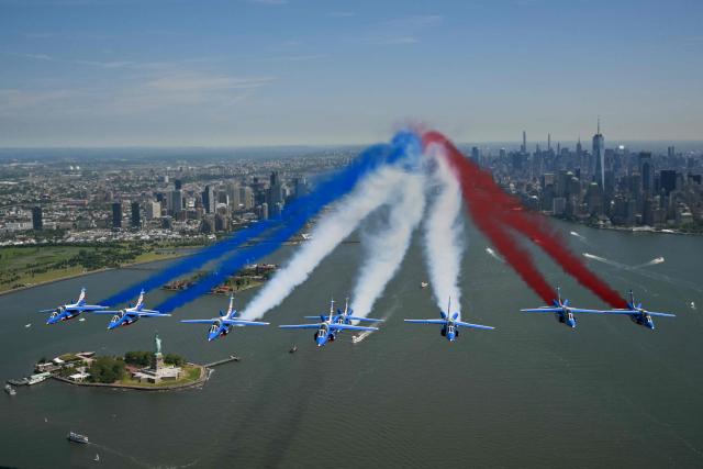 TOPSHOT - The Patrouille de France conducts a flyover above the Statue of Liberty in New York Harbor in commemoration of the 250th anniversary of American independence, in New York City, on June 9, 2026. (Photo by ANGELA WEISS / AFP)