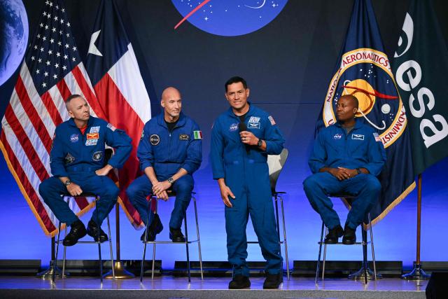 (L/R) NASA astronaut commander Randy Bresnik, ESA (European Space Agency) astronaut pilot Luca Parmitano, NASA astronaut mission specialist Frank Rubio, and NASA astronaut mission specialist Andre Douglas speak during a press conference announcing the crew for the Artemis III mission at NASA's Johnson Space Center in Houston, Texas, on June 9, 2026. The Italian Luca Parmitano will be the pilot of NASA's Artemis 3 voyage, the first European to join one of the program's missions. Parmitano, who will represent the European Space Agency, is one of four men named as crewmembers tasked with carrying out Artemis 3, which is targeting launch in late 2027. (Photo by RONALDO SCHEMIDT / AFP)