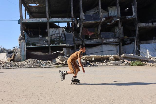 A Palestinian boy skates at the Jabalia refugee camp in the northern Gaza Strip, on June 9, 2026. (Photo by Omar AL-QATTAA / AFP)