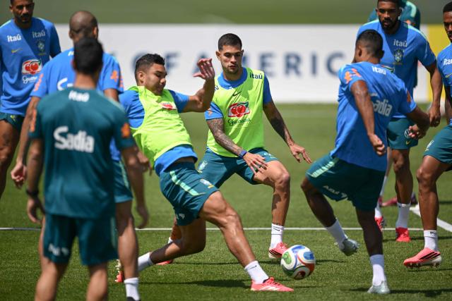 Brazil's midfielders Casemiro (L) and Bruno Guimaraes (C) fight for the ball during a training session as part of the team's preparation for its FIFA World Cup football tournament opening match against Morocco at Columbia Park Training Facility in Morristown, New Jersey on June 9, 2026. (Photo by MAURO PIMENTEL / AFP)