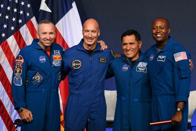 (L/R) NASA astronaut commander Randy Bresnik, ESA (European Space Agency) astronaut pilot Luca Parmitano, NASA astronaut mission specialist Frank Rubio, and NASA astronaut mission specialist Andre Douglas speak during a press conference announcing the crew for the Artemis III mission at NASA's Johnson Space Center in Houston, Texas, on June 9, 2026. The Italian Luca Parmitano will be the pilot of NASA's Artemis 3 voyage, the first European to join one of the program's missions. Parmitano, who will represent the European Space Agency, is one of four men named as crewmembers tasked with carrying out Artemis 3, which is targeting launch in late 2027. (Photo by RONALDO SCHEMIDT / AFP)