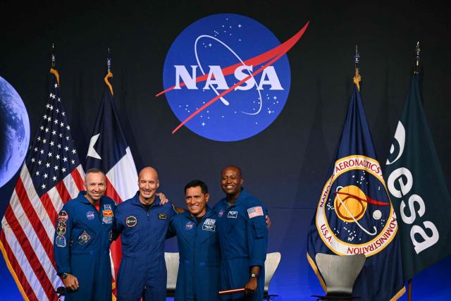 (L/R) NASA astronaut commander Randy Bresnik, ESA (European Space Agency) astronaut pilot Luca Parmitano, NASA astronaut mission specialist Frank Rubio, and NASA astronaut mission specialist Andre Douglas speak during a press conference announcing the crew for the Artemis III mission at NASA's Johnson Space Center in Houston, Texas, on June 9, 2026. The Italian Luca Parmitano will be the pilot of NASA's Artemis 3 voyage, the first European to join one of the program's missions. Parmitano, who will represent the European Space Agency, is one of four men named as crewmembers tasked with carrying out Artemis 3, which is targeting launch in late 2027. (Photo by RONALDO SCHEMIDT / AFP)