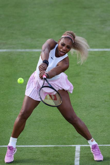 US player Serena Williams returns while playing with Canada's Victoria Mboko against US player Nicole Melichar-Martinez and New Zealand's Erin Routliffe during their round of 16, doubles match at the HSBC WTA tennis Championships at Queen's Club in west London on June 9, 2026. (Photo by Adrian Dennis / AFP)