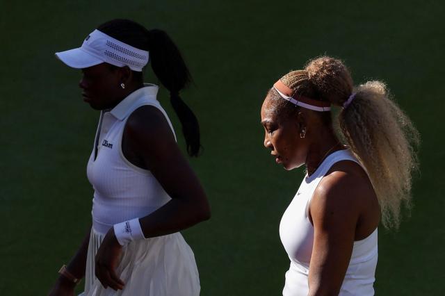 US player Serena Williams (R) walks with Canada's Victoria Mboko (L) while playing against US player Nicole Melichar-Martinez and New Zealand's Erin Routliffe during their round of 16, doubles match at the HSBC WTA tennis Championships at Queen's Club in west London on June 9, 2026. (Photo by Adrian Dennis / AFP)
