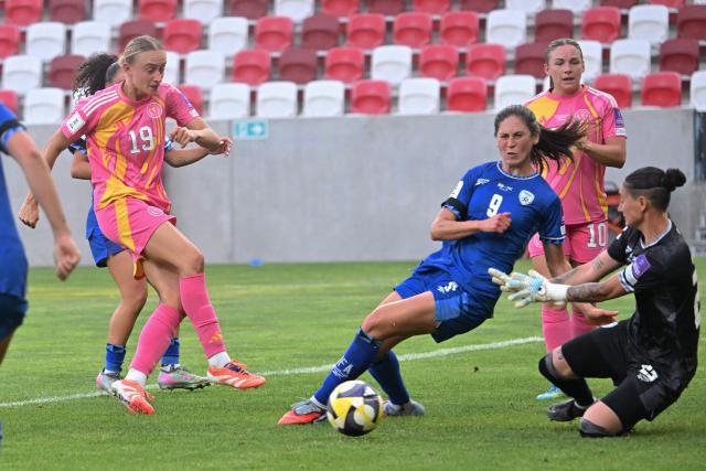 Scotland's defender #19 Lauren Davidson (L) attempts to score past Israel's forward #09 Rahel Steinschneider and Israel's goalkeeper #23 Fortuna Rubin (R) during the FIFA Women's World Cup Europe Zone Qualifiers League B Group 4 football match between Israel and Scotland at the Bozsik Arena in Budapest on June 9, 2026. (Photo by Attila KISBENEDEK / AFP)