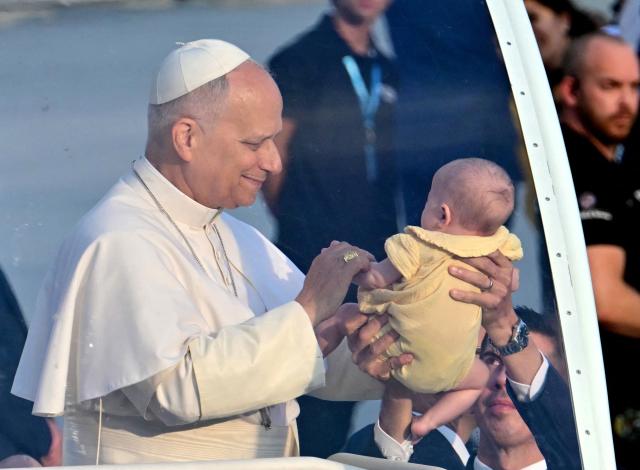 Pope Leo XIV blesses a child as he arrives to attend a prayer vigil at the Lluis Companys Olympic Stadium in Barcelona, on June 9, 2026. Pope Leo XIV is visiting Spain June 6-12 with stops in Madrid, Barcelona, and the Canary Islands, where he will meet with migrants and organisations dedicated to helping them. (Photo by Stefano RELLANDINI / AFP)
