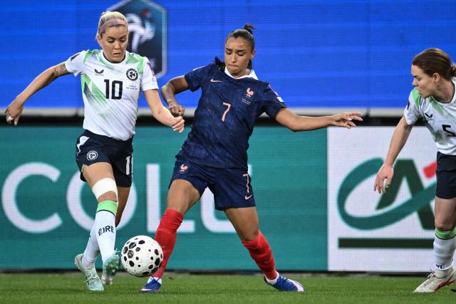 France's midfielder #07 Sakina Karchaoui (C) fights for the ball with Republic of Ireland's midfielder #10 Denise O’Sullivan (L) during the FIFA Women's World Cup Europe Zone Qualifiers League A Group 2 football match between France and Republic of Ireland at the "Stade des Alpes" stadium, Grenoble, central-eastern France, on June 9, 2026 (Photo by JEFF PACHOUD / AFP)