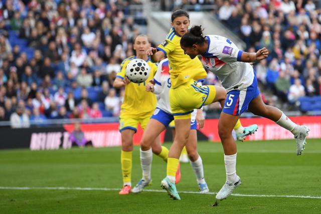 England's defender #05 Jess Carter heads home the opening goal during the Women's 2027 World Cup European Qualifiers, league A, group 3, football match between England and Ukraine at the Hill Dickinson Stadium in Liverpool, north west England, on June 9, 2026. (Photo by PETER POWELL / AFP)