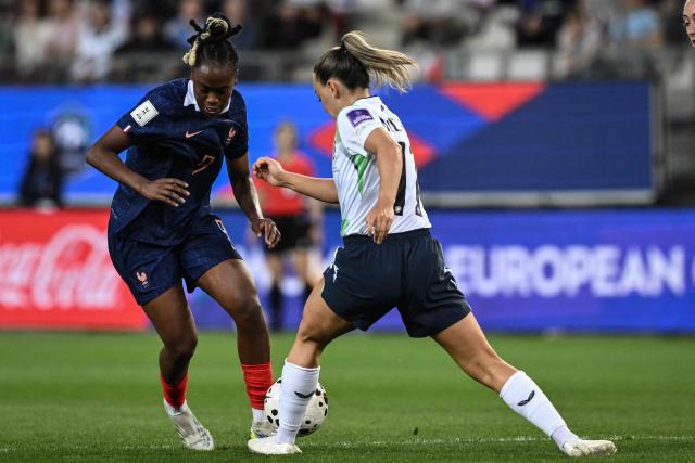 France's forward #09 Melvine Malard (L) fights for the ball with Republic of Ireland forward #11 Katie McCabe (R) during the FIFA Women's World Cup Europe Zone Qualifiers League A Group 2 football match between France and Republic of Ireland at the "Stade des Alpes" stadium, Grenoble, central-eastern France, on June 9, 2026 (Photo by JEFF PACHOUD / AFP)