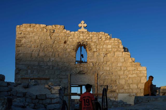People visit the fifth-century Church of St George in the Palestinian Christian village of Taybeh, northeast of Ramallah, in the Israeli-occupied West Bank on June 9, 2026. (Photo by Zain JAAFAR / AFP)