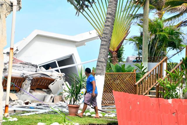 A man looks at damage caused by rough seas ahead of the arrival of Storm Cristina in Itzapa, Guatemala on June 9, 2026. The countries of Central America remain on alert over the effects of Tropical Storm Cristina, which formed on June 8, 2026 in the Pacific Ocean, civil protection services reported. (Photo by AFP)