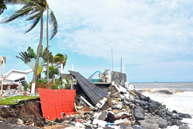 View of damage caused by rough seas ahead of the arrival of Storm Cristina in Itzapa, Guatemala on June 9, 2026. The countries of Central America remain on alert over the effects of Tropical Storm Cristina, which formed on June 8, 2026 in the Pacific Ocean, civil protection services reported. (Photo by AFP)