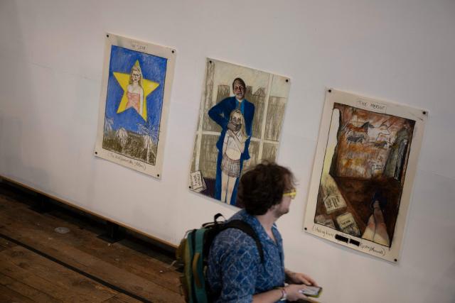 People visit the pop-up exhibit "Donald J. Trump and Jeffrey Epstein Memorial Reading Room" where 3,437 bound volumes of the "Epstein Files" are on display in Washington, DC, on June 9, 2026. (Photo by Brendan Smialowski / AFP)