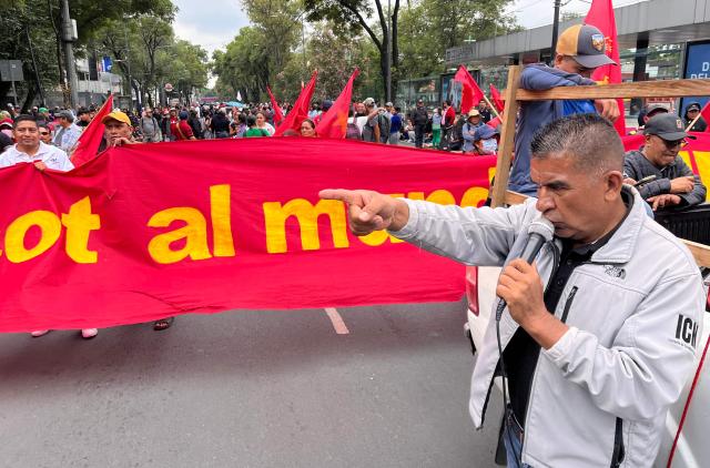 Teachers and studens from Ayotzinapa school march to the Ciudad de Mexico Stadium in Mexico City on June 9, 2026. Thousands of teachers blocked an avenue leading to the Azteca Stadium in Mexico City, 48 hours before the opening ceremony of the 2026 World Cup at that venue. (Photo by Gerardo Magallon / AFP)