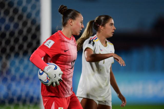 Uruguay's goalkeeper #12 Agustina Sanchez holds the ball past Venezuela's forward #19 Mariana Speckmaier fight for the ball during the CONMEBOL Nations League Women football match between Uruguay and Venezuela at the Centenario stadium in Montevideo on June 9, 2026. (Photo by Dante FERNANDEZ / AFP)