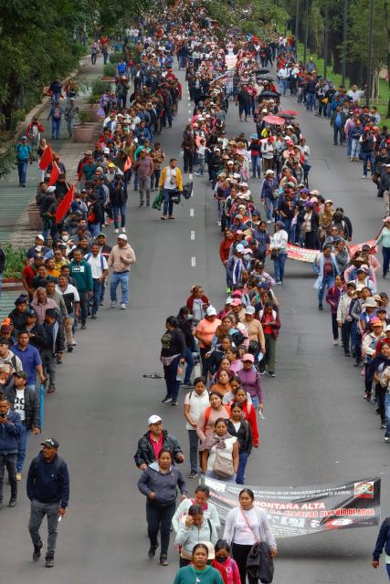 Teachers and studens from Ayotzinapa school march to the Ciudad de Mexico Stadium in Mexico City on June 9, 2026. Thousands of teachers blocked an avenue leading to the Azteca Stadium in Mexico City, 48 hours before the opening ceremony of the 2026 World Cup at that venue. (Photo by Gerardo Magallon / AFP)