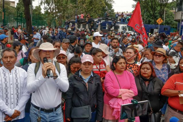 Teachers and studens from Ayotzinapa school march to the Ciudad de Mexico Stadium in Mexico City on June 9, 2026. Thousands of teachers blocked an avenue leading to the Azteca Stadium in Mexico City, 48 hours before the opening ceremony of the 2026 World Cup at that venue. (Photo by Gerardo Magallon / AFP)