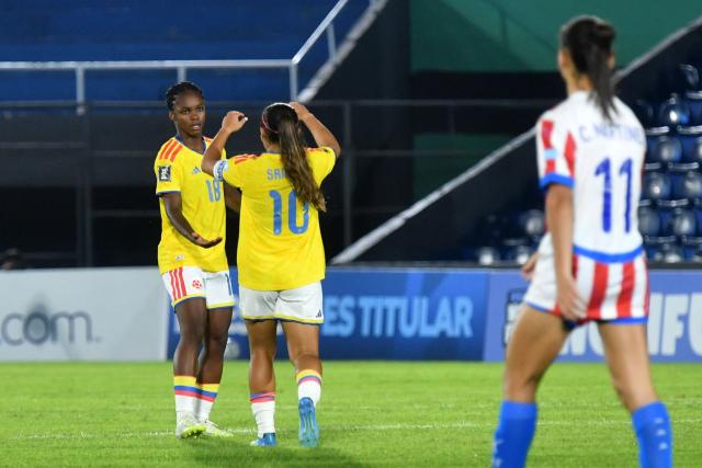 Colombia's forward #18 Linda Caicedo celebrates with her teammate Colombia's midfielder #10 Leicy Santos after scoring her team's third goal during the CONMEBOL Nations League Women football match between Paraguay and Colombia at the Defensores del Chaco stadium in Asuncion on June 9, 2026. (Photo by DANIEL DUARTE / AFP)