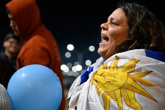 A fan of Uruguay waits for the arrival of the Uruguayan national football team at Carrasco International Airport ahead of their departure to Mexico for the FIFA 2026 World Cup football tournament, in Ciudad de la Costa, Canelones department, Uruguay, on June 9, 2026. (Photo by Santiago Mazzarovich / AFP)