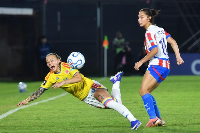 Colombia's defender #04 Ana Guzman and Paraguay's forward #11 Claudinha fight for the ball during the CONMEBOL Nations League Women football match between Paraguay and Colombia at the Defensores del Chaco stadium in Asuncion on June 9, 2026. (Photo by DANIEL DUARTE / AFP)