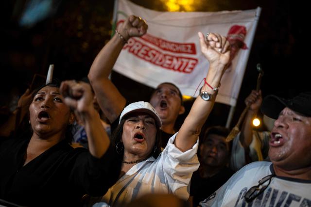 Supporters of Peru's presidential candidate Roberto Sanchez, for the Juntos por el Peru party, protest in front of the National Election Jury (JNE) in Lima on June 9, 2026. The head of Peru's election authority told AFP that the results of the June 7 presidential election may not be known for up to two weeks, dashing hopes of a swift resolution to the ultra-tight race. (Photo by ERNESTO BENAVIDES / AFP)