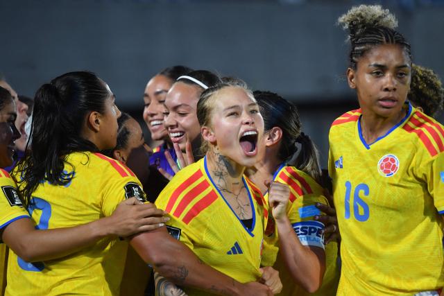 Colombia's defender #04 Ana Guzman celebrates with her teammates after scoring her team's fourth goal during the CONMEBOL Nations League Women football match between Paraguay and Colombia at the Defensores del Chaco stadium in Asuncion on June 9, 2026. (Photo by DANIEL DUARTE / AFP)
