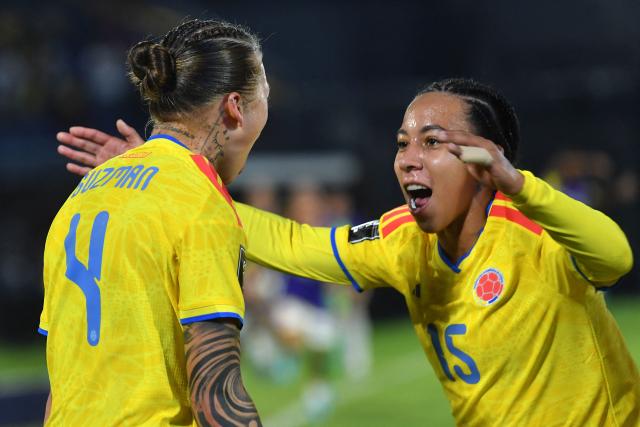 Colombia's defender #04 Ana Guzman celebrates with her teammate Colombia's forward #15 Wendy Bonilla after scoring her team's fourth goal during the CONMEBOL Nations League Women football match between Paraguay and Colombia at the Defensores del Chaco stadium in Asuncion on June 9, 2026. (Photo by DANIEL DUARTE / AFP)