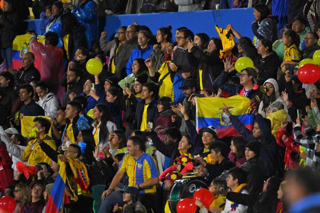 Fans of Ecuador celebrate qualification for the intercontinental playoffs for the 2027 FIFA Women's World Cup at the end of the CONMEBOL Nations League Women football match between Ecuador and Argentina at the Olimpico Atahualpa stadium in Quito on June 9, 2026. (Photo by Rodrigo BUENDIA / AFP)