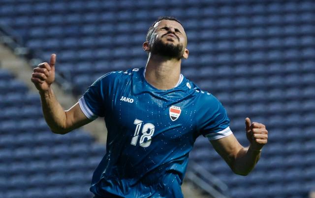 Iraq's forward #18 Aymen Hussein reacts during the international friendly football match between Iraq and Venezuela at SeatGeek Stadium in Bridgeview, Illinois on June 9, 2026. (Photo by KAMIL KRZACZYNSKI / AFP)