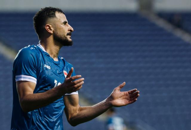 Iraq's forward #18 Aymen Hussein reacts during the international friendly football match between Iraq and Venezuela at SeatGeek Stadium in Bridgeview, Illinois on June 9, 2026. (Photo by KAMIL KRZACZYNSKI / AFP)