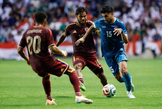 Iraq's defender #15 Ahmed Maknzi vies for the ball with Venezuela's forward #20 Ender Echenique and Venezuela's midfielder #10 Telasco Segovia during the international friendly football match between Iraq and Venezuela at SeatGeek Stadium in Bridgeview, Illinois on June 9, 2026. (Photo by KAMIL KRZACZYNSKI / AFP)