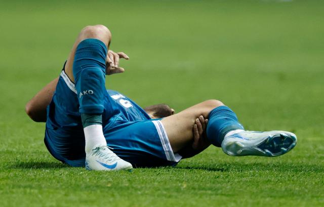 Iraq's defender #15 Ahmed Maknzi holds his leg after colliding with Venezuela's defender #04 Jon Aramburu during the international friendly football match between Iraq and Venezuela at SeatGeek Stadium in Bridgeview, Illinois on June 9, 2026. (Photo by KAMIL KRZACZYNSKI / AFP)