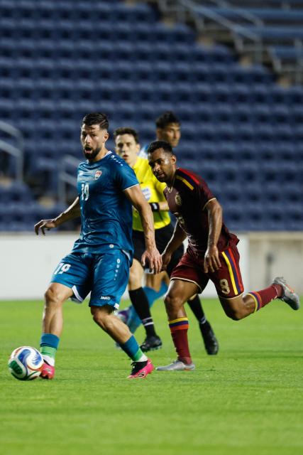 Iraq's midfielder #19 Kevin Yakob controls the ball during the international friendly football match between Iraq and Venezuela at SeatGeek Stadium in Bridgeview, Illinois on June 9, 2026. (Photo by KAMIL KRZACZYNSKI / AFP)