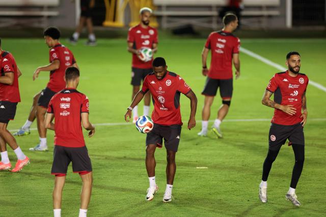 Tunisia's forward Firas Chaouat (C) and teammate defender Dylan Bronn take part in a training session at Rayados Training Centre in Santiago, Nuevo Leon state, Mexico on June 9, 2026, ahead of the 2026 World Cup football tournament. (Photo by Julio Cesar AGUILAR / AFP)