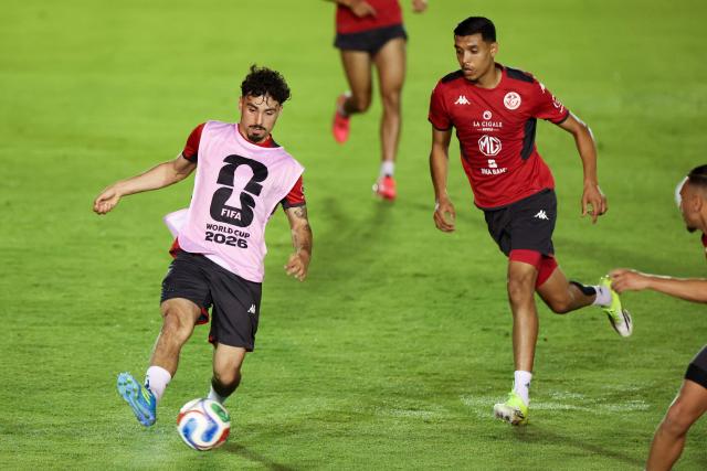 Tunisia's forward Sebastian Tounekti (L) and teammate defender Adam Arous take part in a training session at Rayados Training Centre in Santiago, Nuevo Leon state, Mexico on June 9, 2026, ahead of the 2026 World Cup football tournament. (Photo by Julio Cesar AGUILAR / AFP)