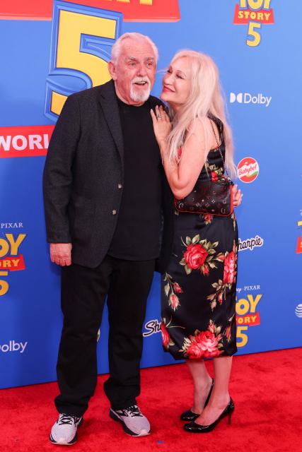 US actor John Ratzenberger and his wife Julie Blichfeldt attend Disney and Pixar's "Toy Story 5" premiere at the Dolby Theatre in Los Angeles on June 9, 2026. (Photo by VALERIE MACON / AFP)