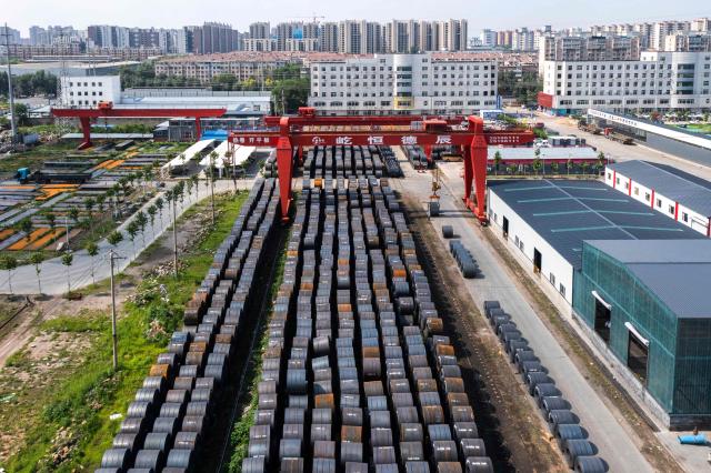 Rolls of steel are stored at a steel wholesale market in Shenyang, in China’s northeast Liaoning province, on June 10, 2026. (Photo by CN-STR / AFP) / China OUT