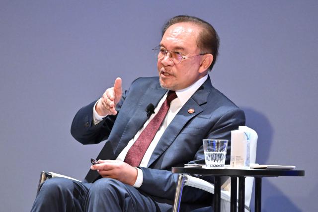 Malaysia's Prime Minister Anwar Ibrahim answers questions at the Nikkei Forum at a hotel in Tokyo on June 10, 2026. (Photo by Kazuhiro NOGI / AFP)
