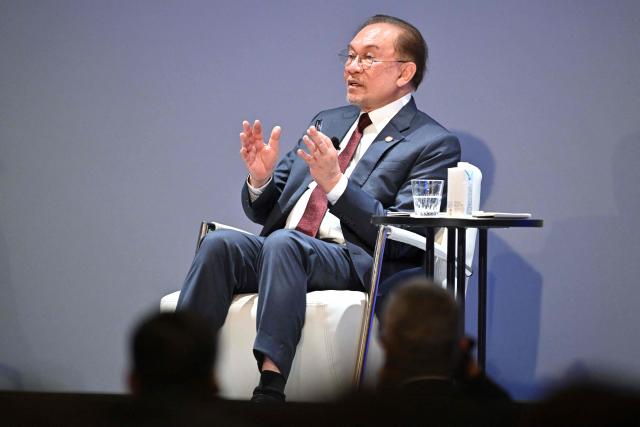 Malaysia's Prime Minister Anwar Ibrahim answers questions at the Nikkei Forum at a hotel in Tokyo on June 10, 2026. (Photo by Kazuhiro NOGI / AFP)