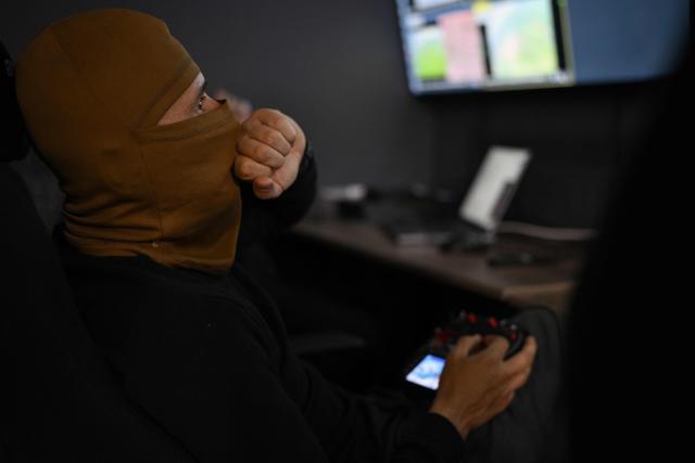 A serviceman from the 7th Battalion of the “Madyar’s Birds” brigade operates a mid-range drone from an underground control room at an undisclosed location in Ukraine, on May 15, 2026, amid the Russian invasion of Ukraine. Unlike deep-strike drones, which fly hundreds of kilometres into Russian territory, mid-range drones use real-time visual guidance to hit frontline support targets inside occupied territories. (Photo by Genya SAVILOV / AFP)