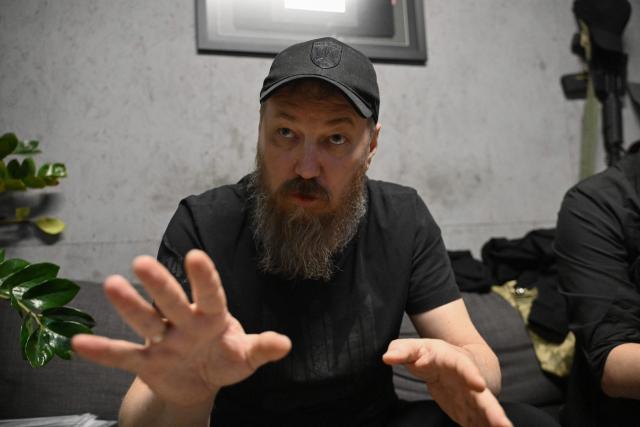 In this recent photograph released on June 9, 2026, the Commander of Ukraine's Unmanned Forces, Robert Brovdi, known as "Madyar", answers AFP's journalists' questions during an interview in a command post at an undisclosed location in Ukraine, amid the Russian invasion of Ukraine. (Photo by Genya SAVILOV / AFP)