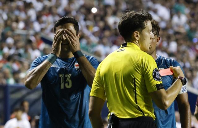 Iraq's forward #13 Ali Yousif reacts after the referee shows him a red card during the international friendly football match between Iraq and Venezuela at SeatGeek Stadium in Bridgeview, Illinois on June 9, 2026. (Photo by KAMIL KRZACZYNSKI / AFP)
