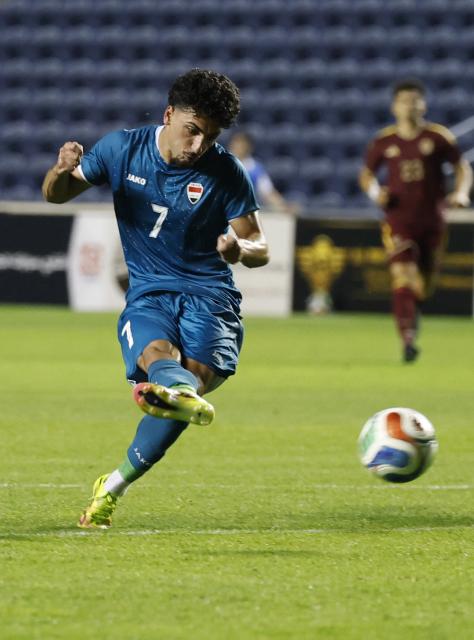 Iraq's midfielder #07 Amyn Youssef takes a shot during the international friendly football match between Iraq and Venezuela at SeatGeek Stadium in Bridgeview, Illinois on June 9, 2026. (Photo by KAMIL KRZACZYNSKI / AFP)