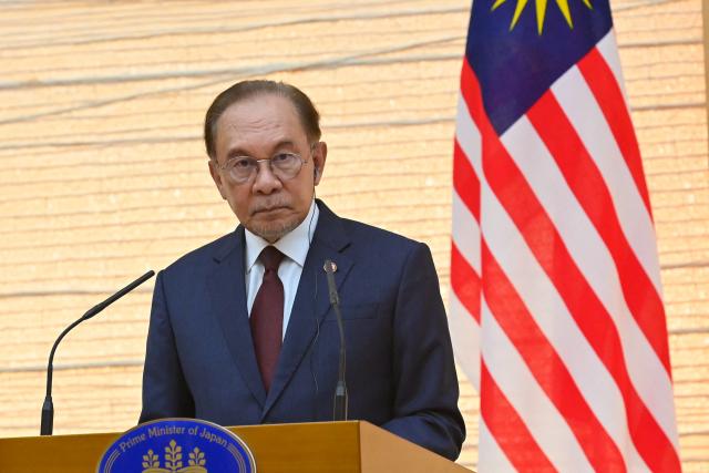 Malaysia's Prime Minister Anwar Ibrahim attends a joint press announcement with Japan's Prime Minister Sanae Takaichi (not pictured) following their bilateral meeting at the Prime Minister’s Office in Tokyo on June 10, 2026. (Photo by David Mareuil / POOL / AFP)