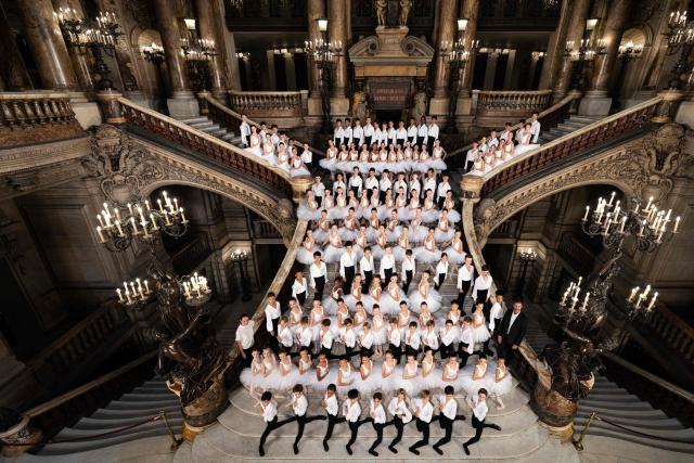 Students of the Paris Opera Dance School pose in the Grand Staircase of the Opera Garnier in Paris on October 4, 2024. It is a tradition passed down orally, from one generation of young dancers to the next: at the Paris Opera Ballet School, students are taught the art of French classical ballet, a three-century-old artistic heritage that is attracting more and more foreign dancers. (Photo by JOEL SAGET / AFP)