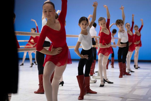 Students of the 5th division of the Paris Opera Ballet School perform on the stage of the Opera Garnier on December 15, 2024. It is a tradition passed down orally, from one generation of young dancers to the next: at the Paris Opera Ballet School, students are taught the art of French classical ballet, a three-century-old artistic heritage that is attracting more and more foreign dancers. (Photo by JOEL SAGET / AFP)